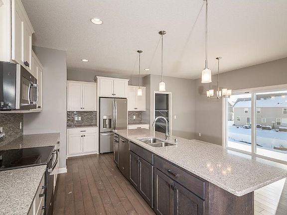 The kitchen is certainly a point of focus.  Counter top space, walk in pantry, and sliding glass door for future deck!