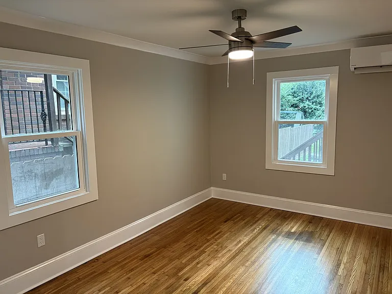 Bedroom with ceiling fan and mini-split HVAC
