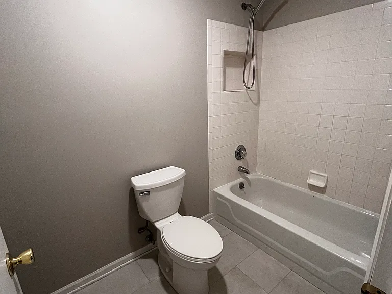 master bedroom with an en suite full bathroom