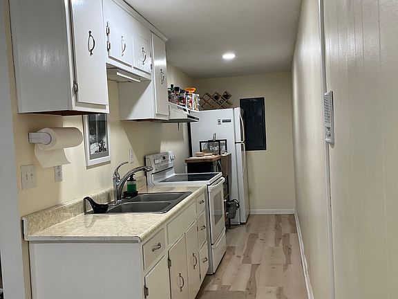 Kitchen with refrigerator stove and oven 
no dishwasher