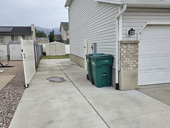 RV Parking- 40 ft behind the gate, more parking in front of gate and gravel pad off back yd corner.