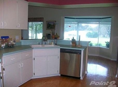Kitchen includes Eat In Dinette with Mitered Bay Window overlooking Golf Course