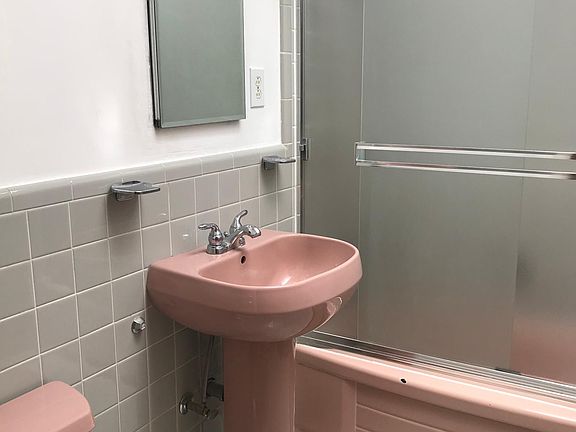 Bathroom has a skylight.