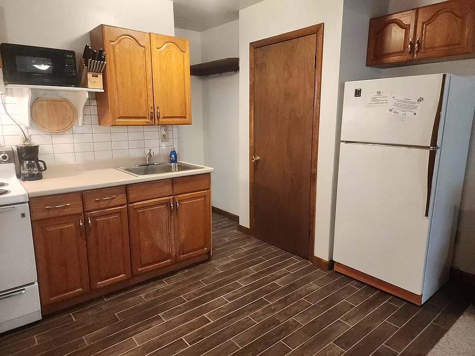 Kitchen area with closet and storage area