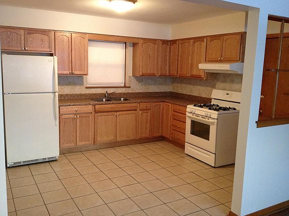 Kitchen has newer cabinets, appliances and tile flooring.