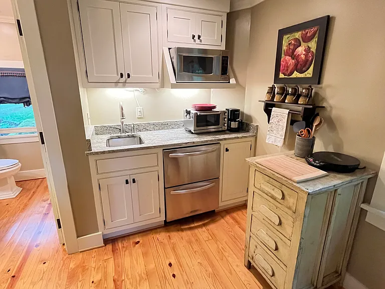 Well thought out kitchenette with supplies for cooking or bringing in carryout.
