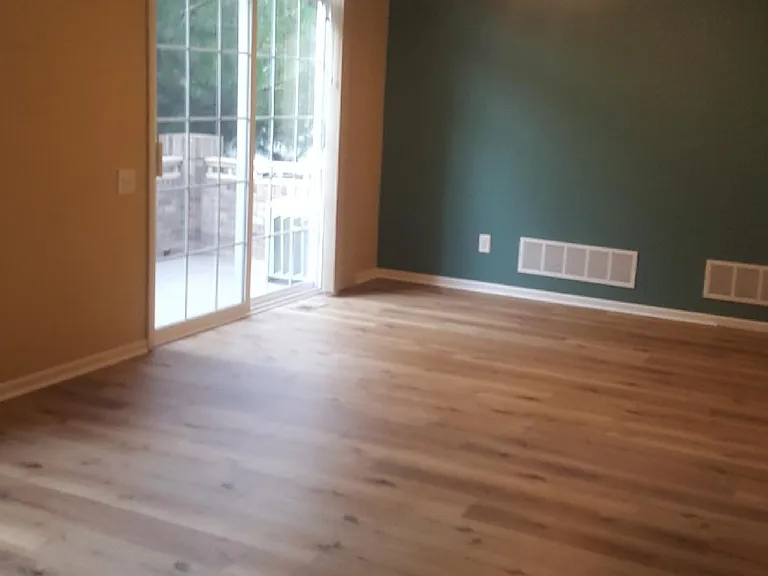 Brand new manufactured wood flooring in great room attached to porch