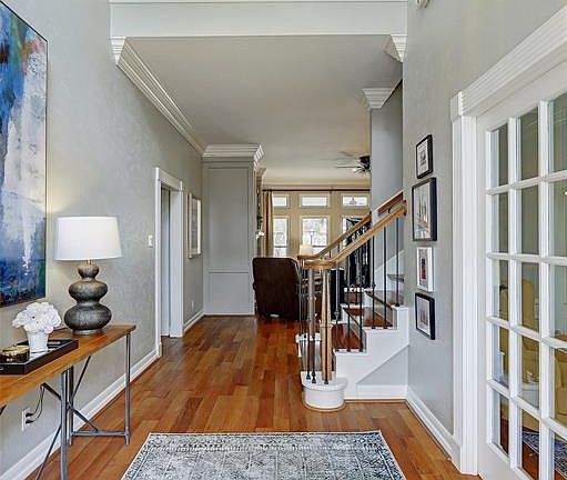 The light-filled entry is wide and welcoming. The high ceilings add an open feeling to the area.