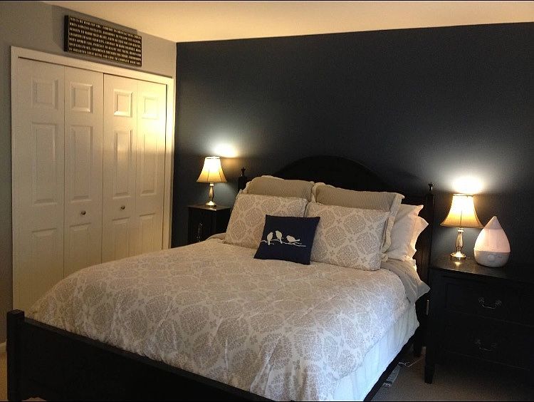 Bedroom comfortably fits queen size bed, nightstands and dre