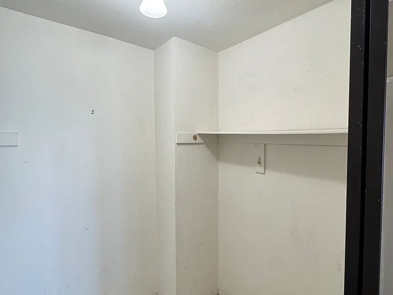 Primary bedroom walk in closet