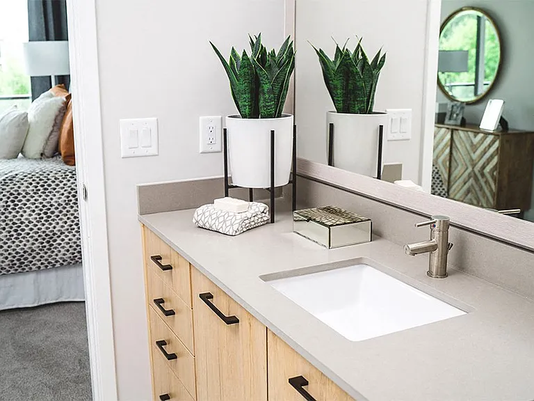 Bathrooms feature contemporary fixtures, double vanities and framed mirrors