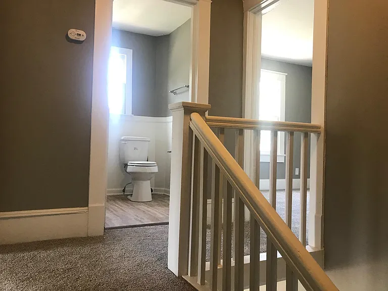 Upstairs landing and full bathroom between two large bedrooms.