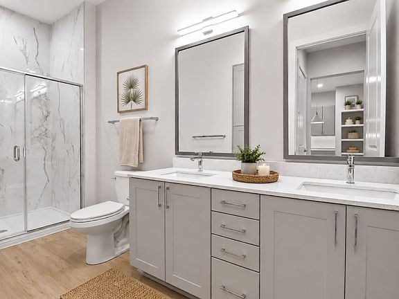 Refined finishes and a modern sensibility transform the bathroom into a space that's both beautiful and beautifully functional.