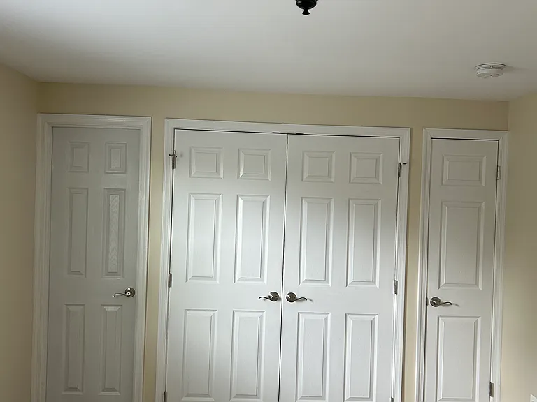 Master bathroom entrance, two clothing closets