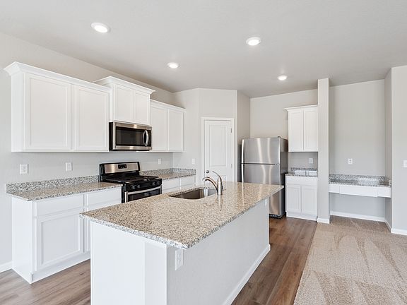 The kitchen in the Pike has beautiful, granite countertops.