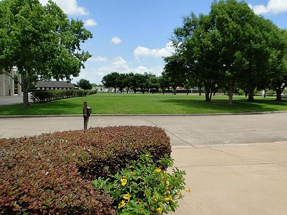This is the view from the front of the house. It is situated across from a church and has a great view of the front green space.