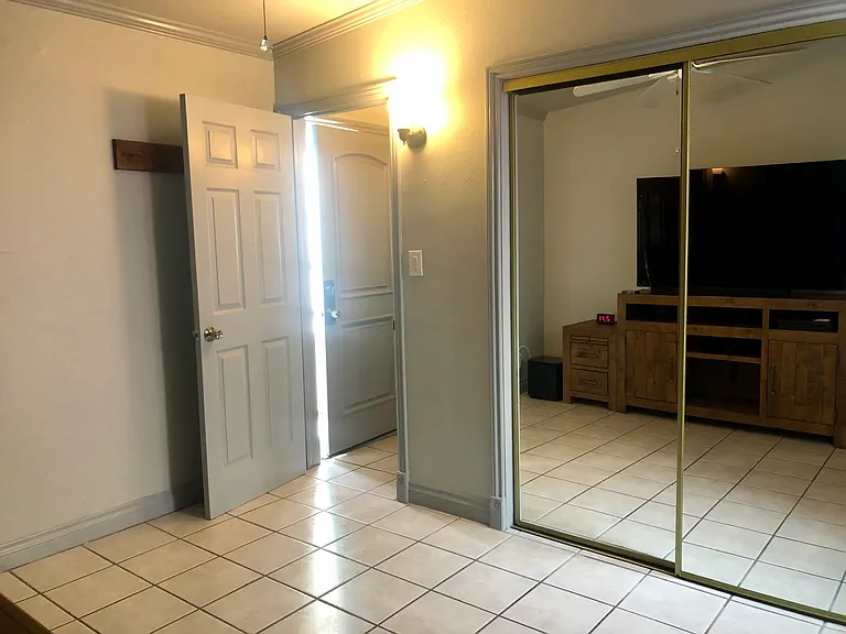 Smaller bedroom, closet and door