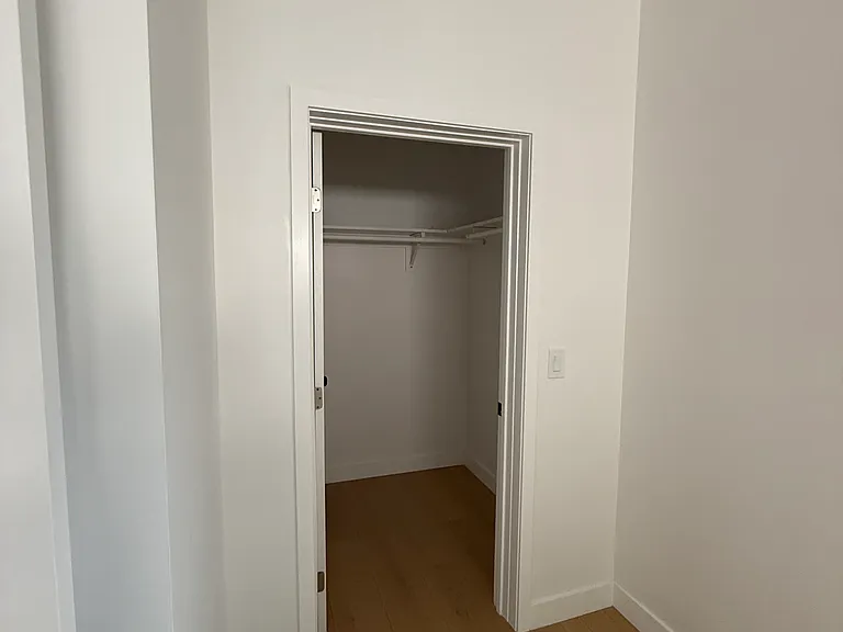 Primary bedroom walk in closet