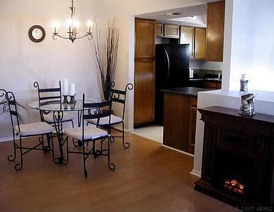 Eat in Kitchen - updated wood flooring and lighting/electric fireplace stays!!
