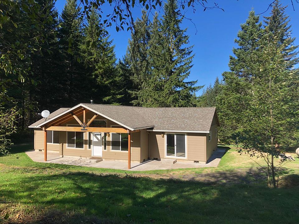 Front of the home from the field above the house