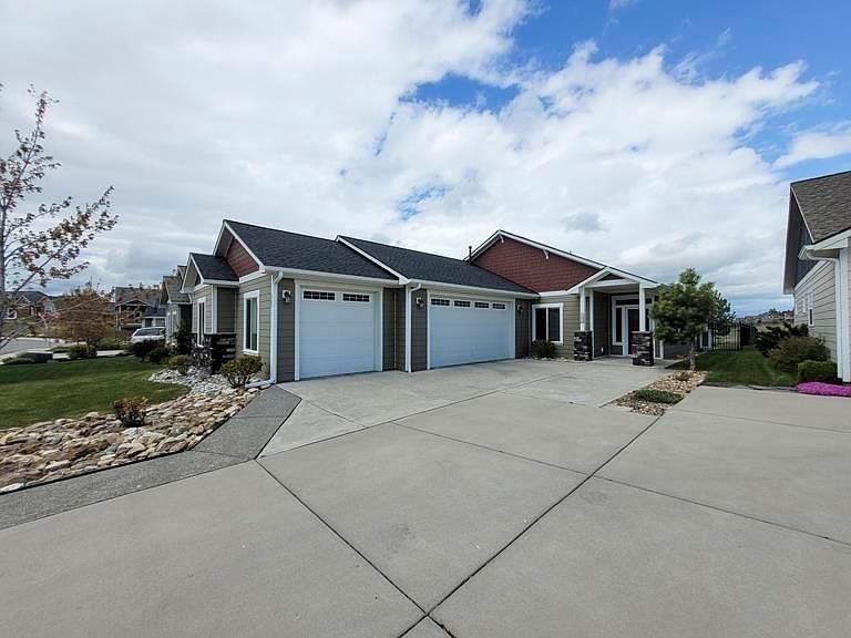 Front view of the house with three stall garage