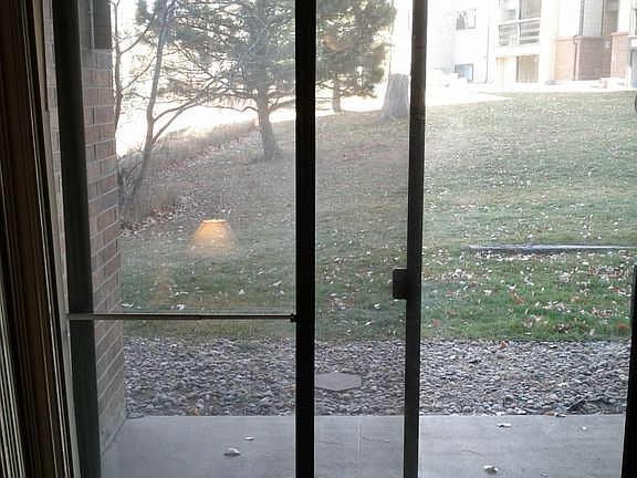 Patio backs to open space.