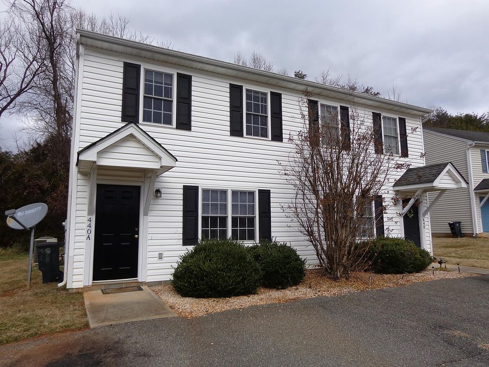 Front of duplex showing 2 parking spots
