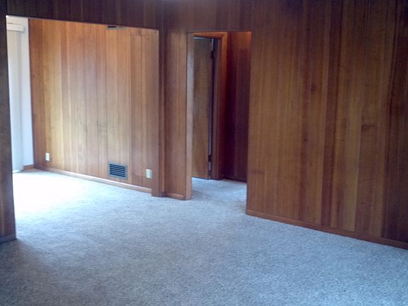 living room looking toward dining area and bedrooms