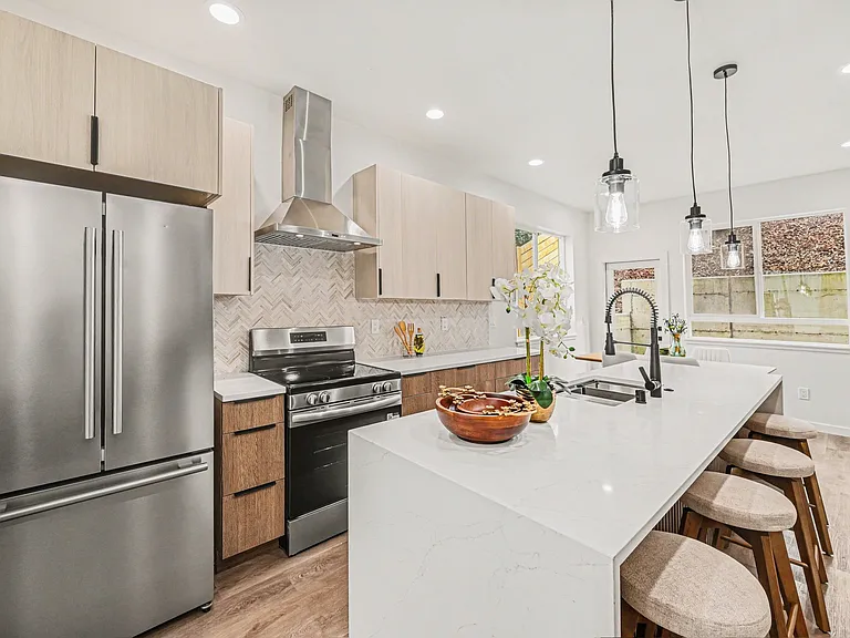 Kitchens is complete with huge island, stainless steel appliances included built in microwave, quartz countertops, stone backsplashes, full range hood, high quality fixtures.