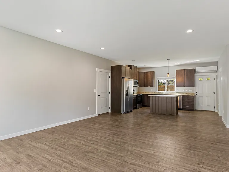 Open concept living room looking into the kitchen.