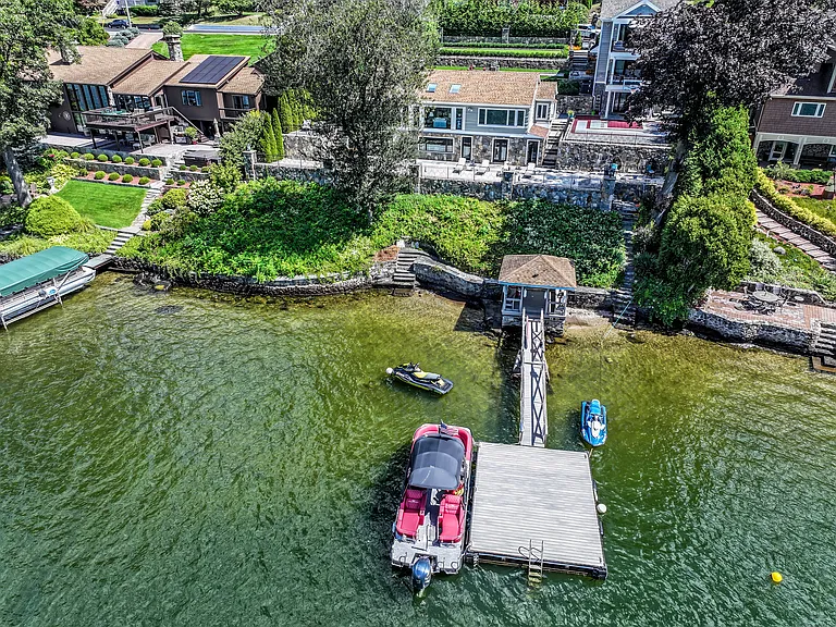 Just steps from the water's edge, the lakefront gazebo and boat dock are perfect for lakeside entertaining.
