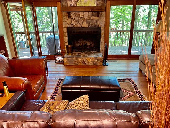 living room with wood burning fireplace