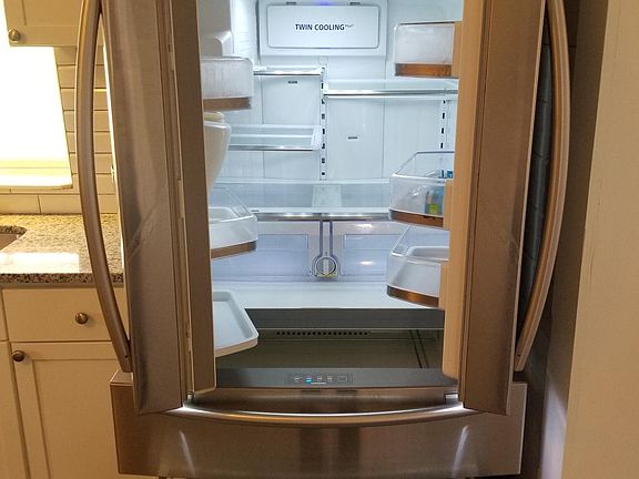 Refrigerator and stove included