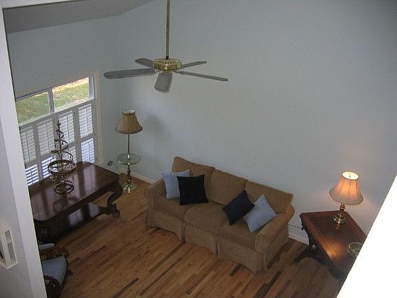 entertain guests in the living room with vaulted ceiling