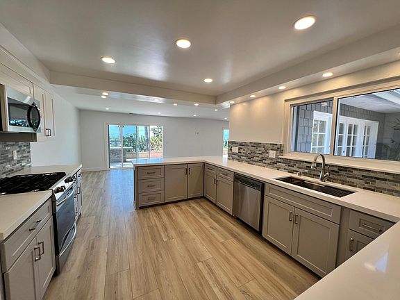 Kitchen with views to the interior courtyard and ocean-facing patio.