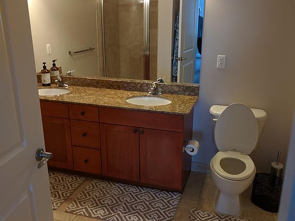 Master Bathroom with spa tub and shower