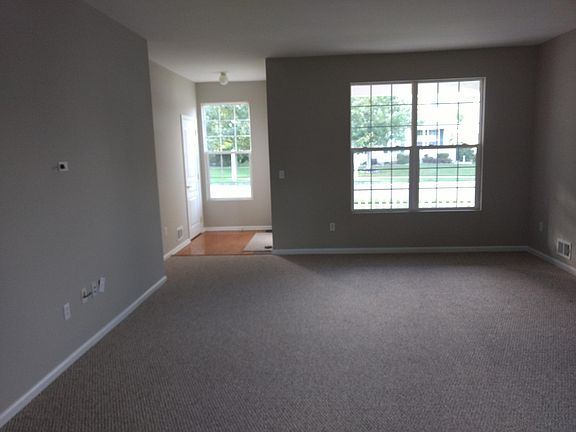 FRONT FOYER ENTRANCE TO LIVING ROOM