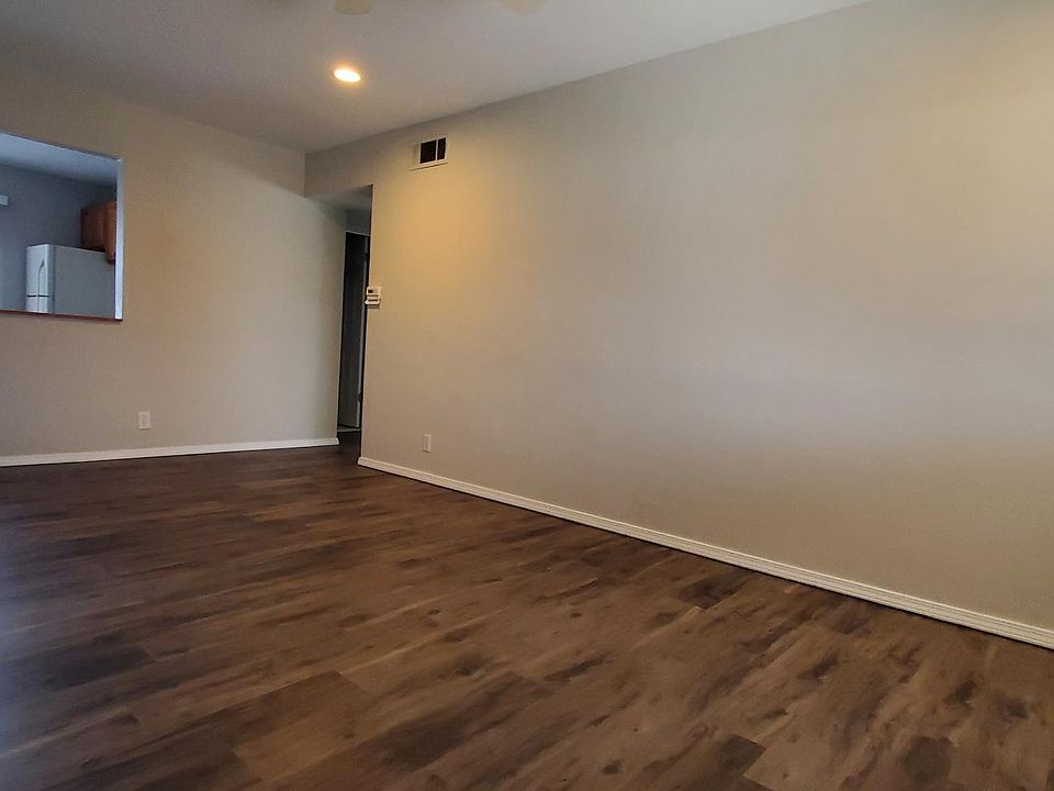 Livingroom - view from front door. Upagraded vinly flooring.