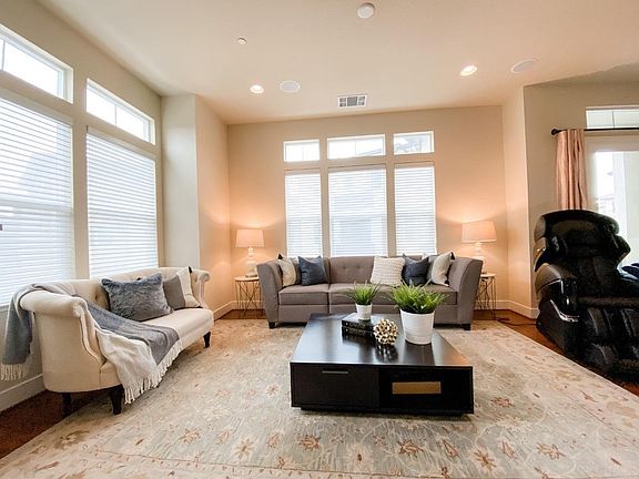 The open-concept main floor with high ceilings and abundant natural light
