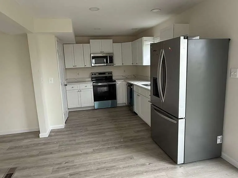 Brand new spacious kitchen with New cabinets, Quartz, appliances.