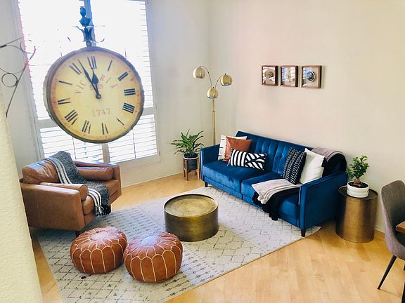 Large Living Room with High Ceilings, Hardwood Floors and Wood Shutters