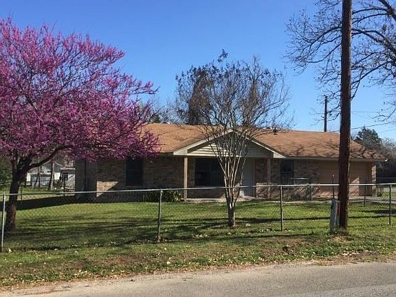 Front yard includes a crepe myrtle as well as a beautiful redbud tree.