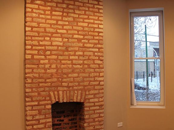 Architectural detail of exposed brick and fireplace (non-wor