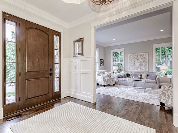 Mahogany entry door, rich wainscoting & trim thru-out!