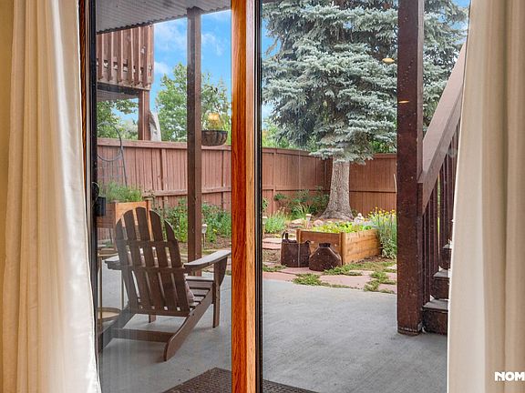 View of patio and garden from living room.