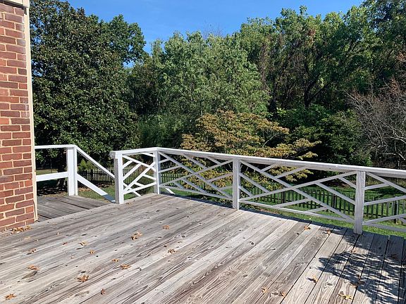 back deck leads to parking and back yard