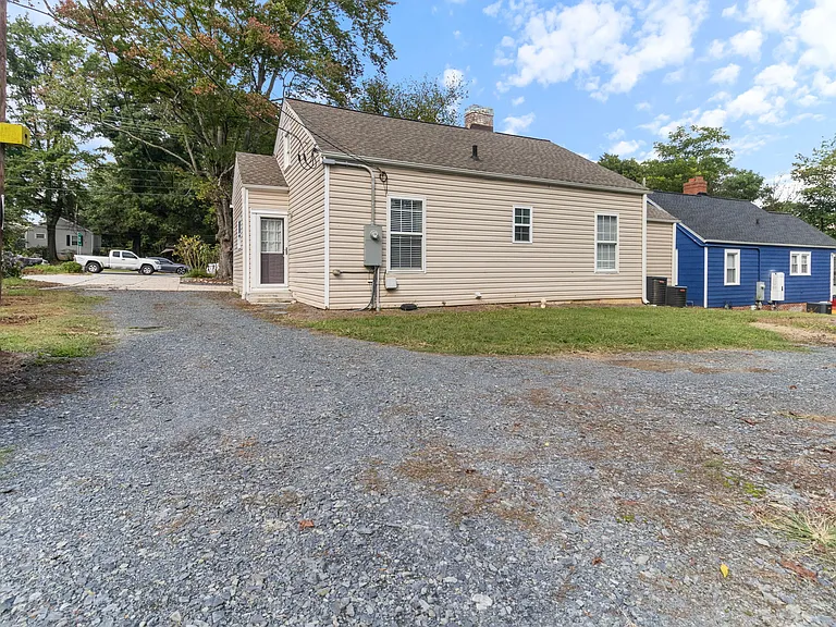 Back of home at Hunsucker's Place, a revitalized 1942 cottage with charming curb appeal, off-street parking, and a prime location near Downtown Greensboro and Cone Health Hospital. Perfect for professionals and travelers seeking comfort and convenience.