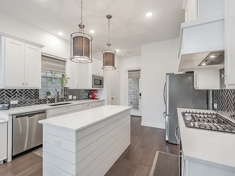 kitchen opens to covered patio for easy grilling
