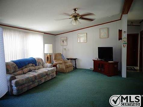 View of living room cathedral ceilings