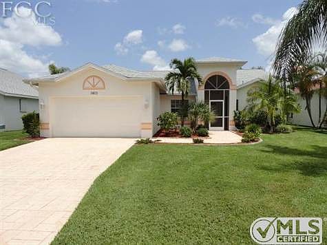 Exterior of Home with Stamped Concrete Drive + Walk.